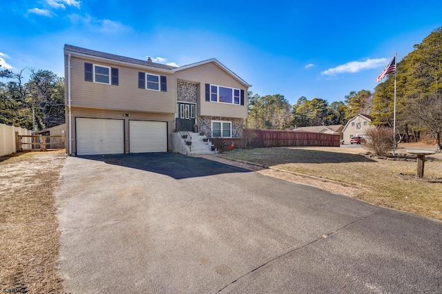 split foyer home featuring a garage