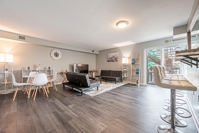 living room featuring dark hardwood / wood-style flooring