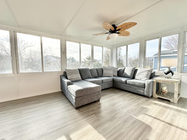 sunroom featuring ceiling fan