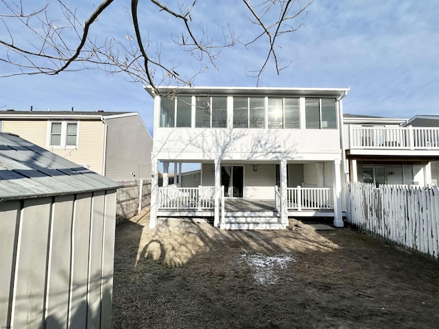 view of front of property featuring a wooden deck and a sunroom