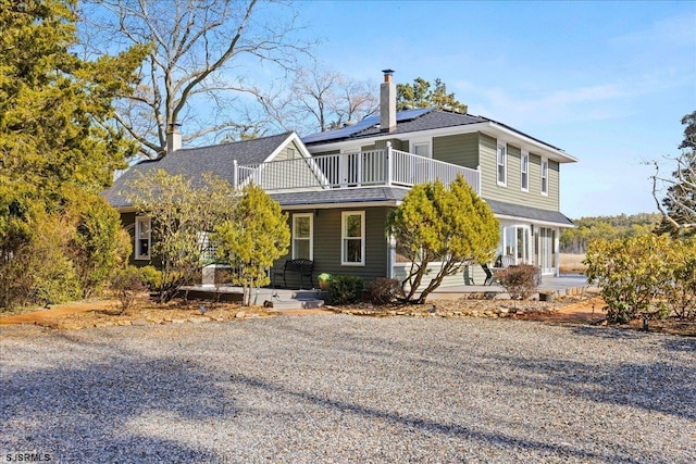 view of property featuring solar panels