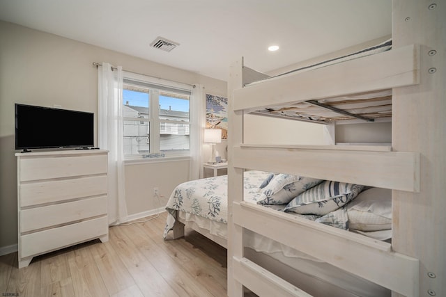 bedroom with light wood-type flooring