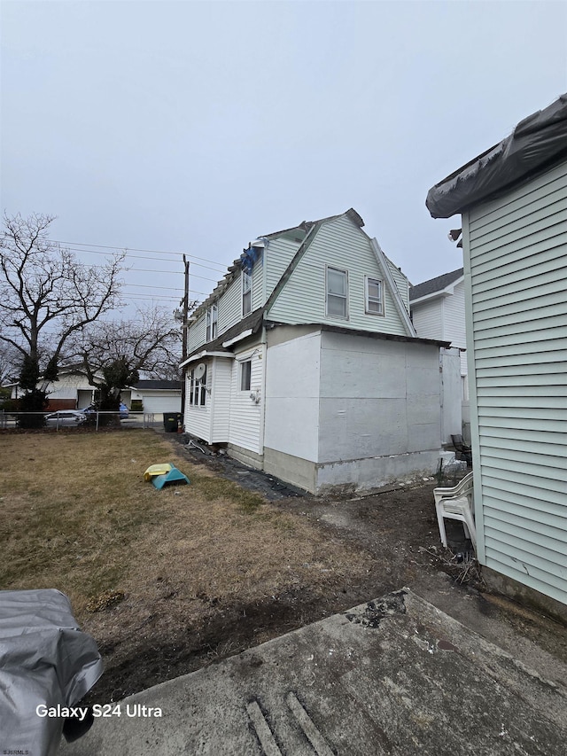 view of side of property with a yard