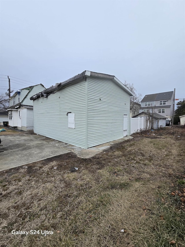 view of side of home with a patio area