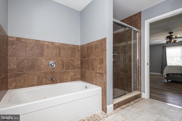 bathroom featuring shower with separate bathtub and ceiling fan