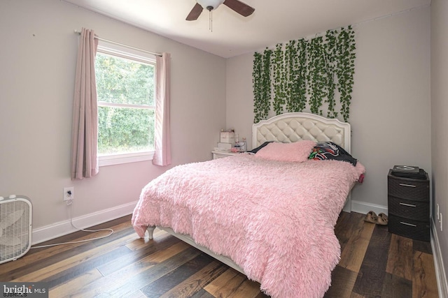 bedroom featuring ceiling fan and dark hardwood / wood-style flooring