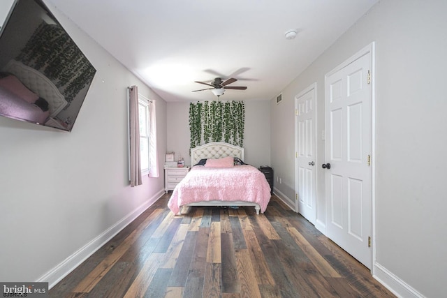 bedroom featuring ceiling fan and dark hardwood / wood-style flooring