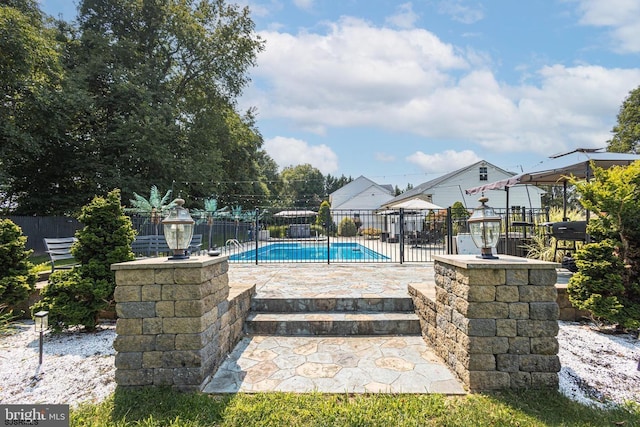 view of swimming pool featuring a patio area