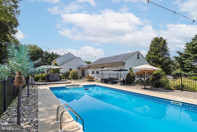 view of pool with a patio and an outdoor hangout area