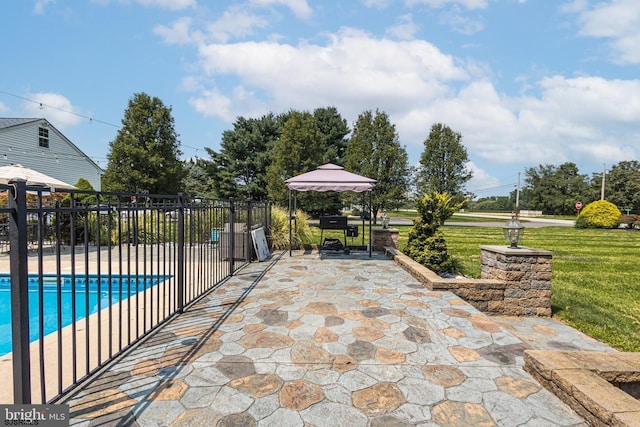 view of patio with a gazebo and a fenced in pool