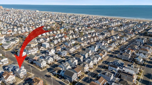 bird's eye view with a view of the beach and a water view