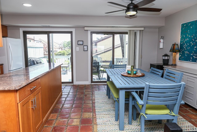 dining room featuring ceiling fan