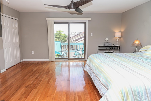 bedroom with ceiling fan, hardwood / wood-style floors, and access to outside