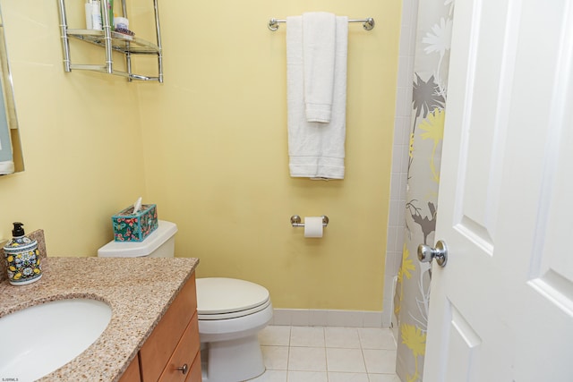 bathroom with vanity, tile patterned floors, and toilet