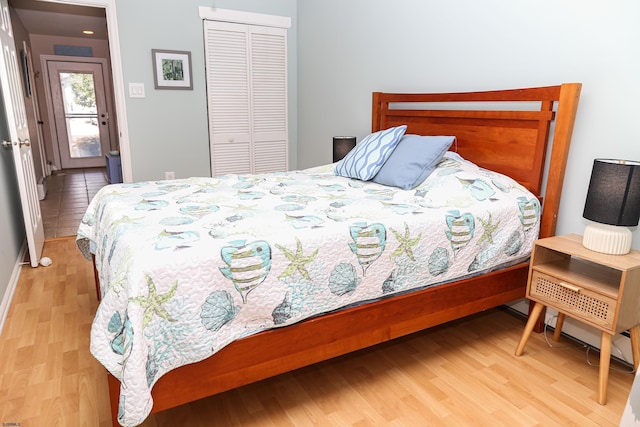 bedroom featuring a closet and light hardwood / wood-style flooring