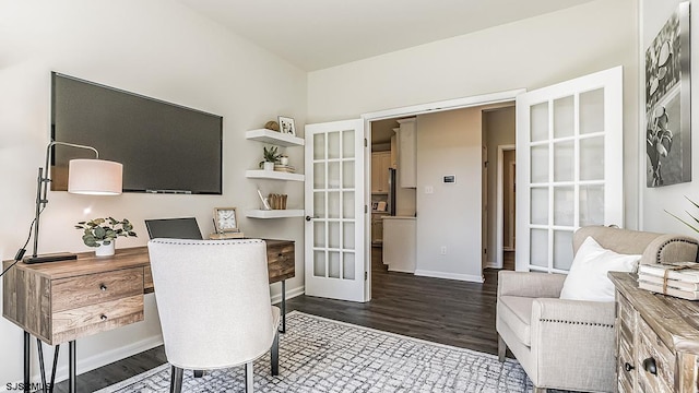 office with dark hardwood / wood-style flooring and french doors