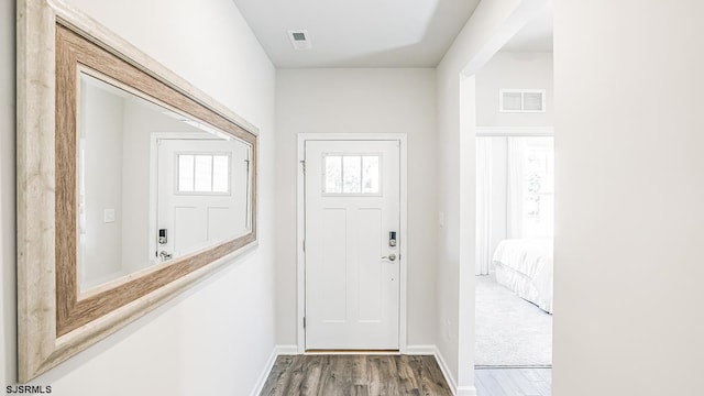 doorway with wood-type flooring