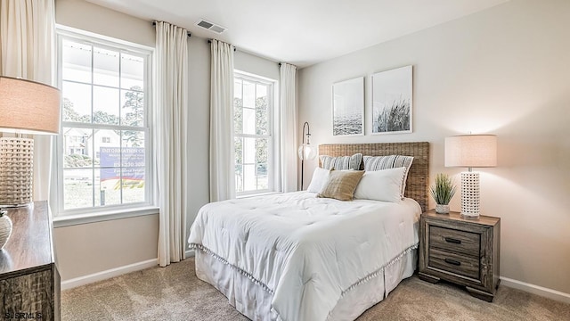 bedroom with light carpet