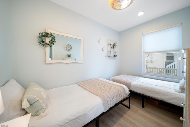 bedroom with wood-type flooring