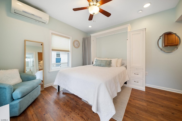 bedroom with ceiling fan, dark hardwood / wood-style flooring, and a wall unit AC