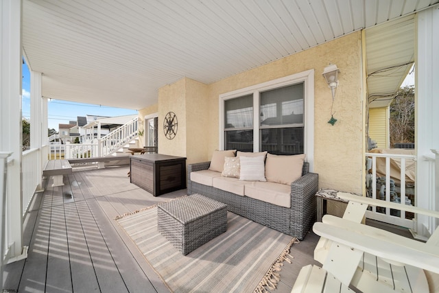 wooden deck featuring an outdoor living space