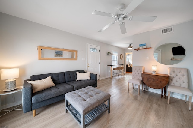 living room with light hardwood / wood-style flooring