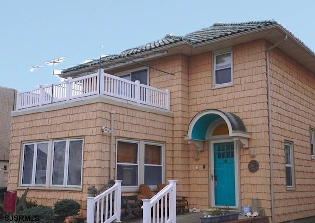 exterior space with a balcony and a patio