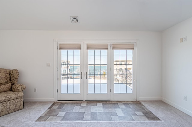 entryway with light carpet