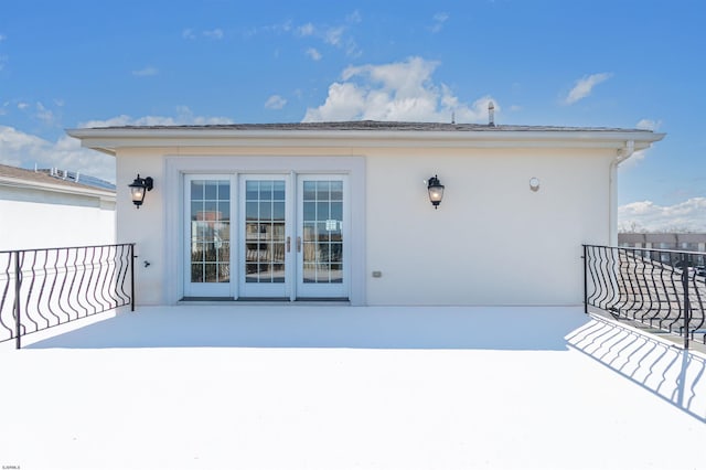 exterior space featuring french doors and a balcony