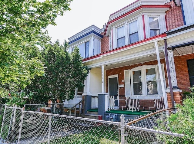 view of property featuring a porch