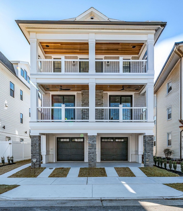 view of front facade with a garage and a balcony