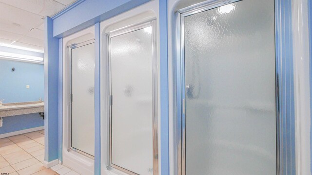 3101 Boardwalk Unit 1512-2, Chelsea Heights, NJ 08401 - bathroom featuring a drop ceiling, tile patterned floors, and walk in shower