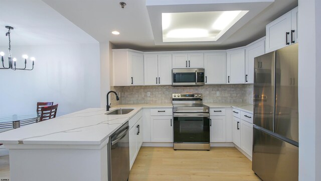 3101 Boardwalk Unit 1512-2, Chelsea Heights, NJ 08401 - kitchen featuring stainless steel appliances, hanging light fixtures, and white cabinets