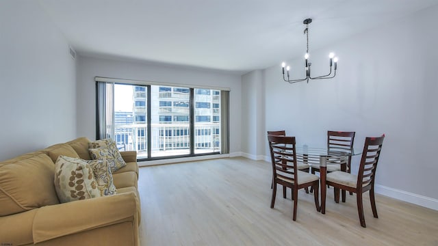 3101 Boardwalk Unit 1512-2, Chelsea Heights, NJ 08401 - dining room with a chandelier and light hardwood / wood-style flooring