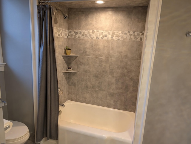 bathroom with toilet and shower / bath combo