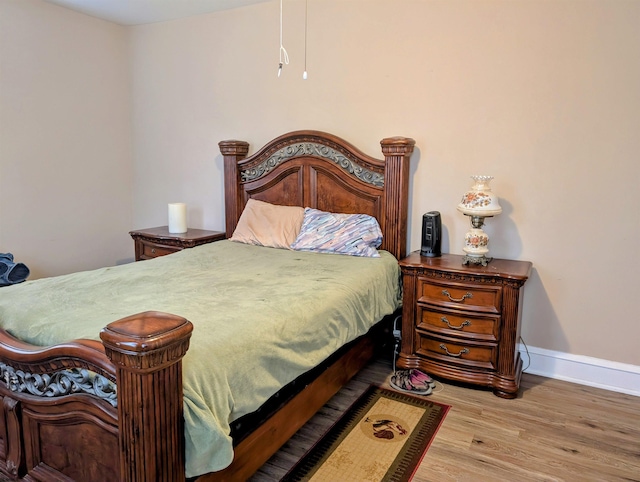 bedroom featuring hardwood / wood-style flooring