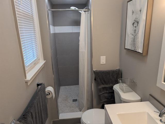 bathroom with vanity, toilet, and a shower with shower curtain