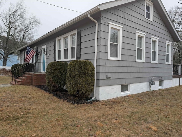 view of home's exterior featuring a lawn