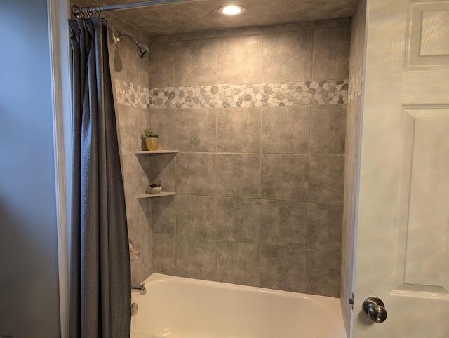 bathroom featuring shower / bathtub combination with curtain