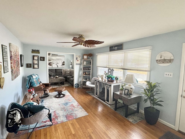 interior space with ceiling fan and hardwood / wood-style floors