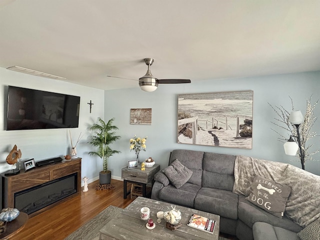 living room with hardwood / wood-style flooring and ceiling fan