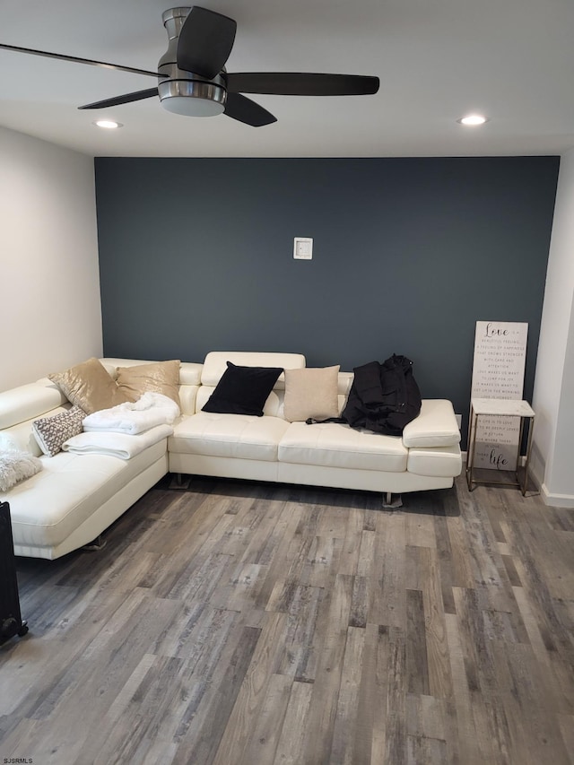 living room with ceiling fan and hardwood / wood-style floors