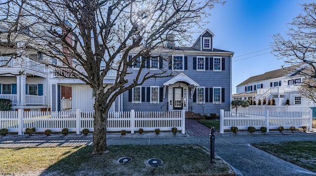 view of front facade with a fenced front yard