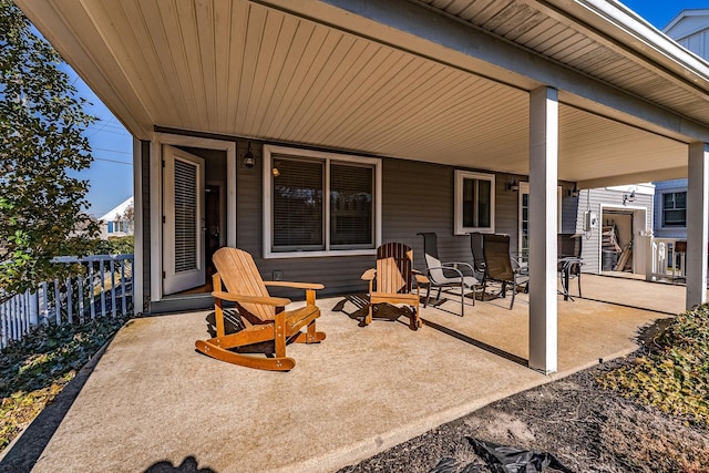 view of patio featuring fence