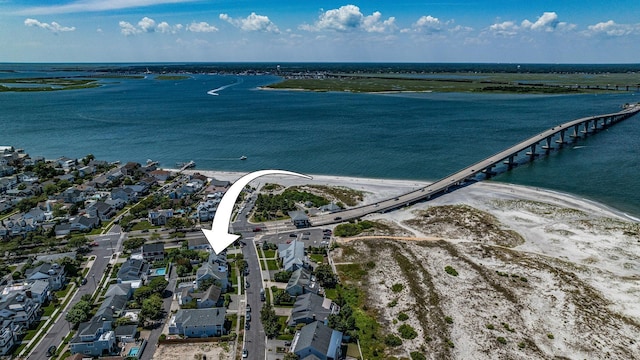 bird's eye view with a water view and a residential view