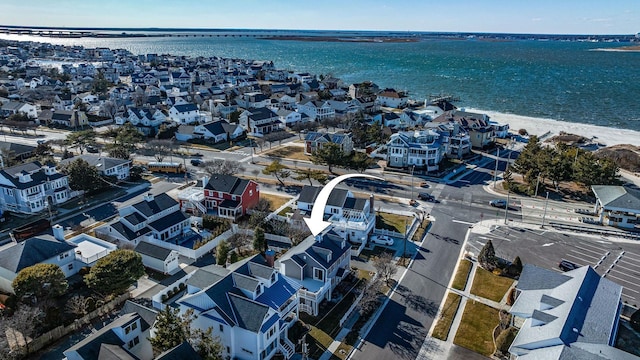 aerial view featuring a residential view and a water view