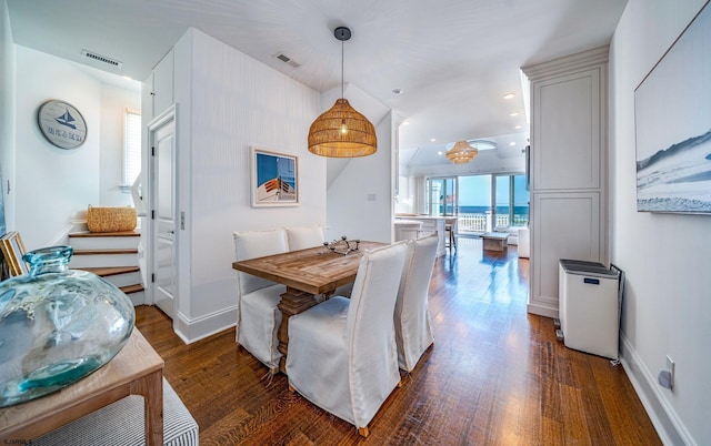 dining area with dark hardwood / wood-style floors