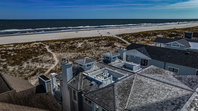 bird's eye view featuring a water view and a view of the beach