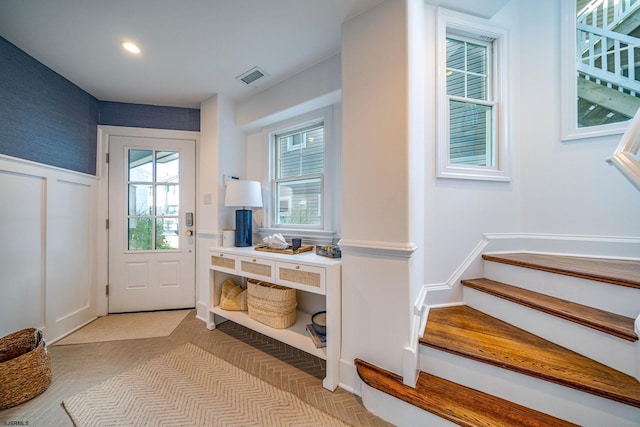 doorway with light parquet flooring