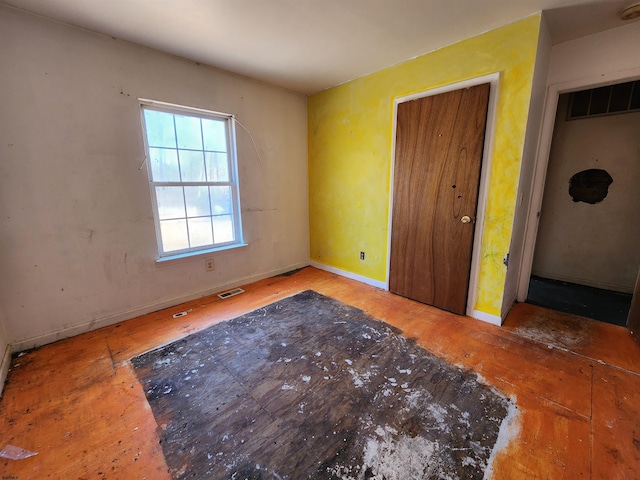 unfurnished bedroom with a closet